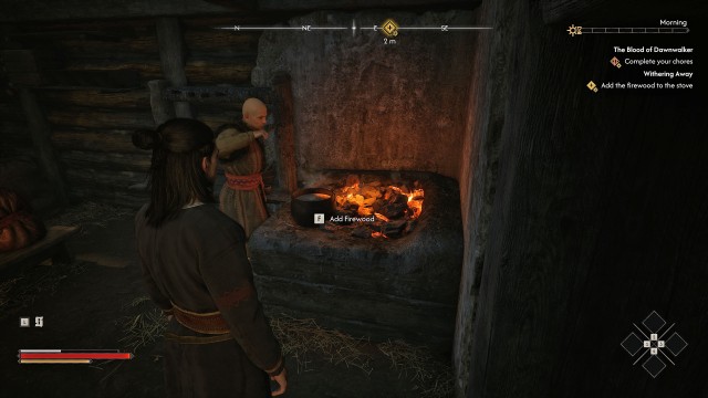 Add the firewood to the stove